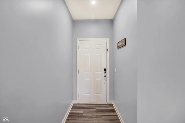 doorway to outside with dark hardwood / wood-style floors