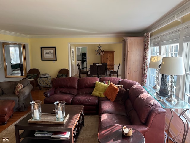 living room with crown molding, an inviting chandelier, and dark hardwood / wood-style flooring