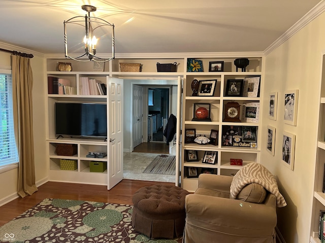 living area featuring crown molding, a chandelier, dark wood-type flooring, and a wealth of natural light