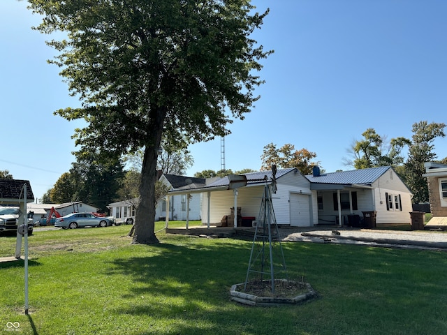 view of front of home featuring a front yard and a garage