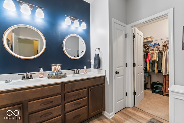 bathroom with vanity and hardwood / wood-style floors