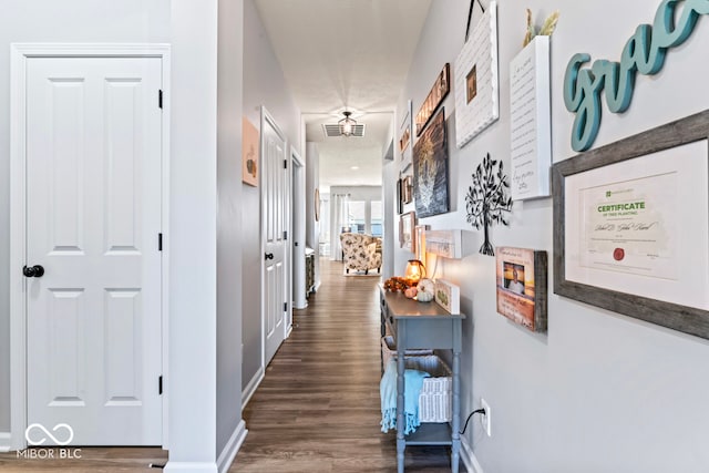 corridor featuring dark hardwood / wood-style floors