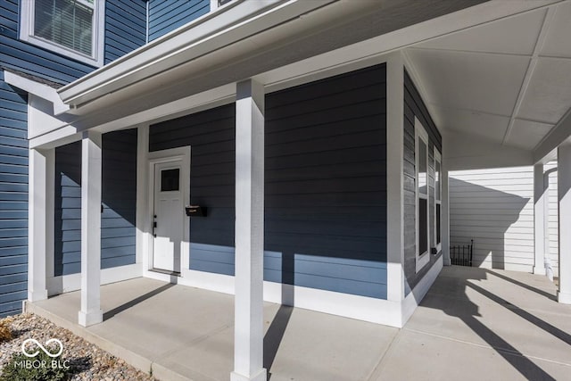 doorway to property featuring a porch