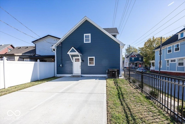 1666 Union St, Indianapolis, IN 46225 - view of front of house featuring fence and central AC unit
