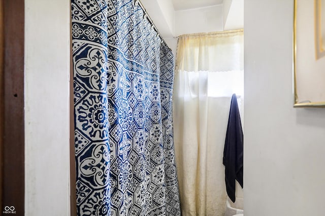 bathroom featuring walk in shower