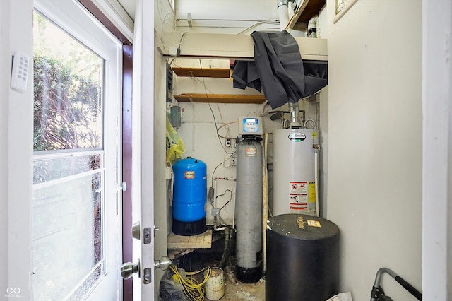 utility room featuring gas water heater