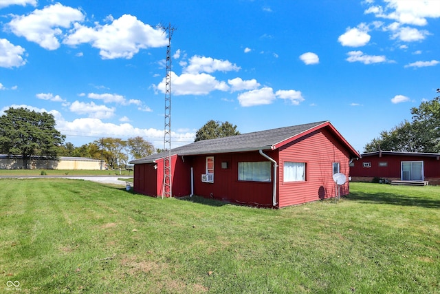 view of home's exterior with a yard