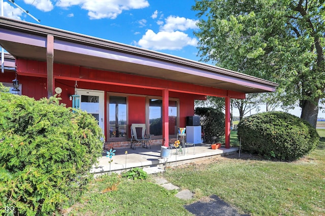 rear view of house with a yard