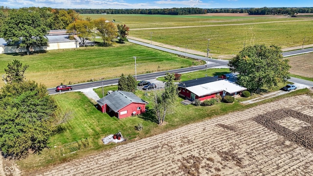 birds eye view of property featuring a rural view