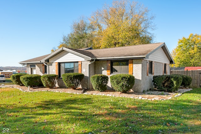 view of side of property featuring a yard