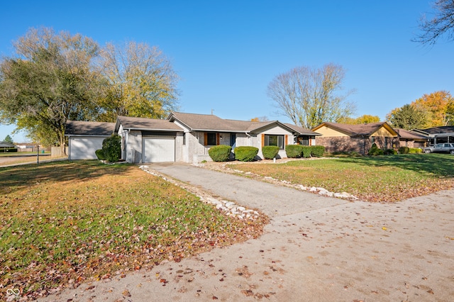 ranch-style home with a front lawn and a garage