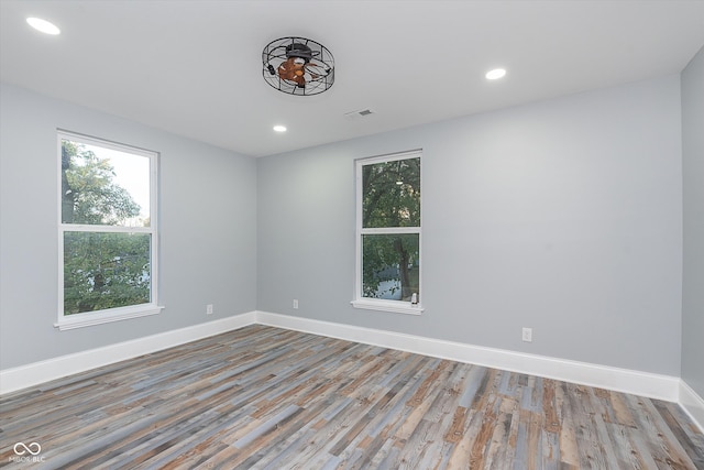 unfurnished room featuring light hardwood / wood-style floors