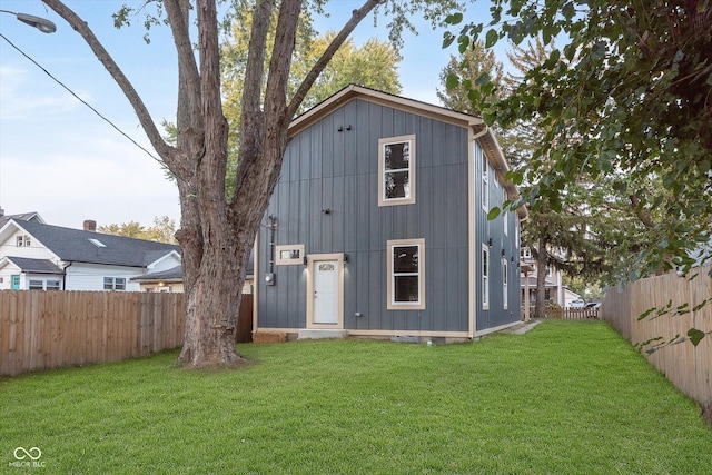 rear view of house with a lawn