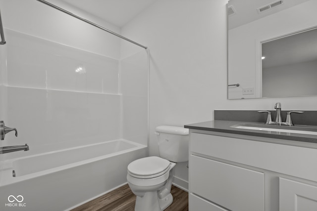 full bathroom with vanity, shower / bathtub combination, toilet, and wood-type flooring