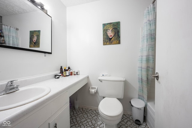 full bathroom featuring vanity, shower / bathtub combination with curtain, toilet, and a textured ceiling