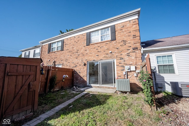 rear view of property featuring cooling unit