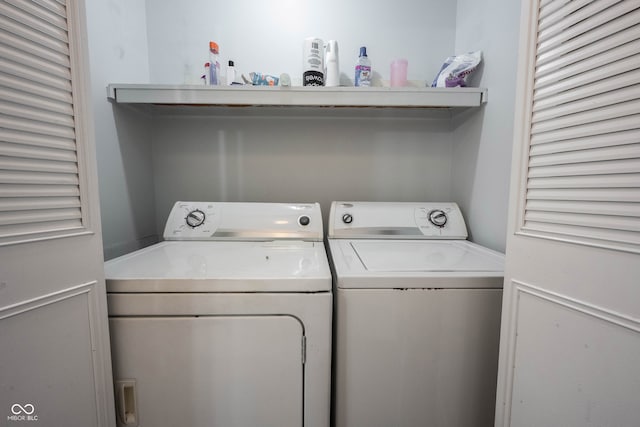 washroom with independent washer and dryer