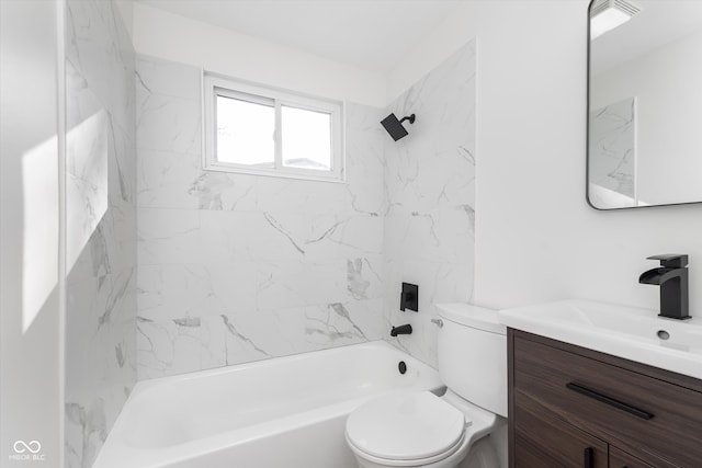 full bathroom with vanity, toilet, and tiled shower / bath