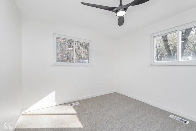 spare room with ceiling fan and carpet flooring