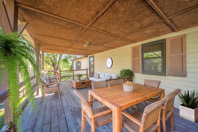 wooden deck with outdoor lounge area