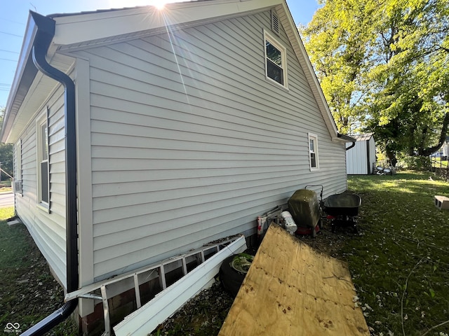 view of property exterior featuring a lawn