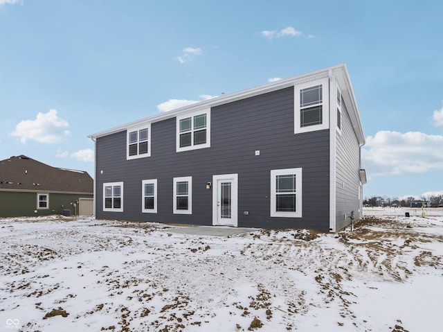 view of snow covered house