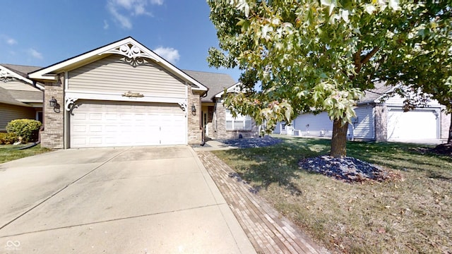 view of front of home featuring a garage and a front lawn