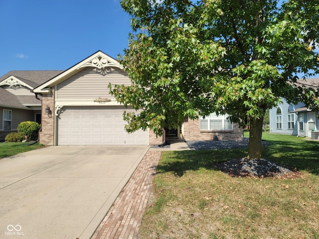 view of front of property with a front yard and a garage