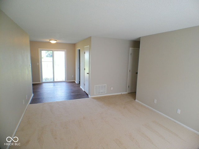 empty room featuring hardwood / wood-style floors