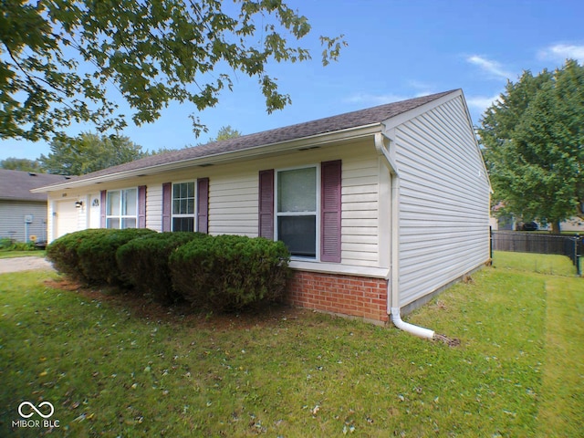 view of home's exterior with a yard