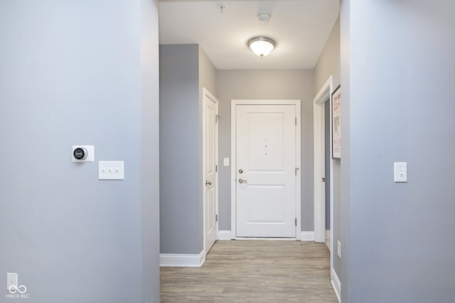 corridor featuring light hardwood / wood-style flooring