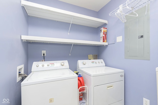 washroom featuring independent washer and dryer and electric panel