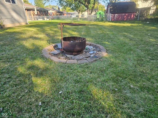 view of yard with a fire pit