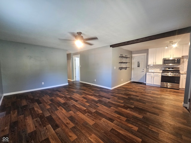 unfurnished living room with ceiling fan, beam ceiling, and dark hardwood / wood-style flooring