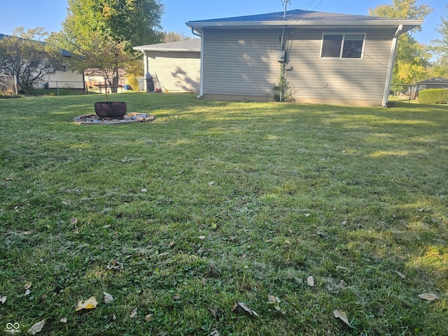 view of yard with an outdoor fire pit