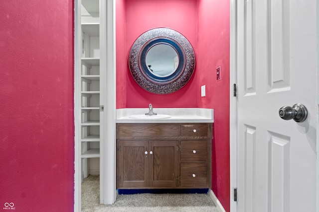 bathroom with built in features and vanity