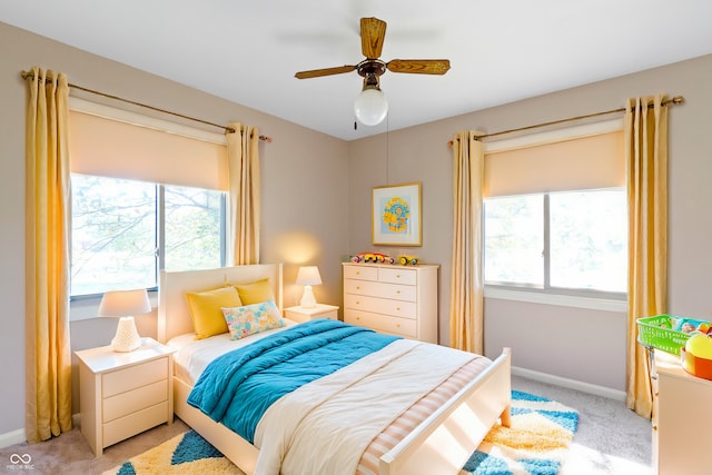 carpeted bedroom featuring ceiling fan