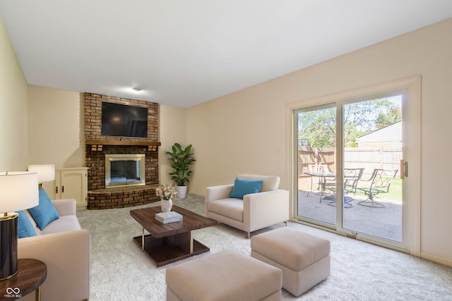 living room with a brick fireplace and light colored carpet