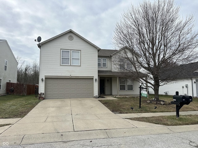 view of front property featuring a front lawn and a garage