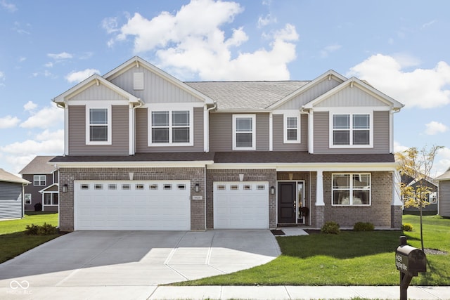 craftsman house with a garage and a front lawn