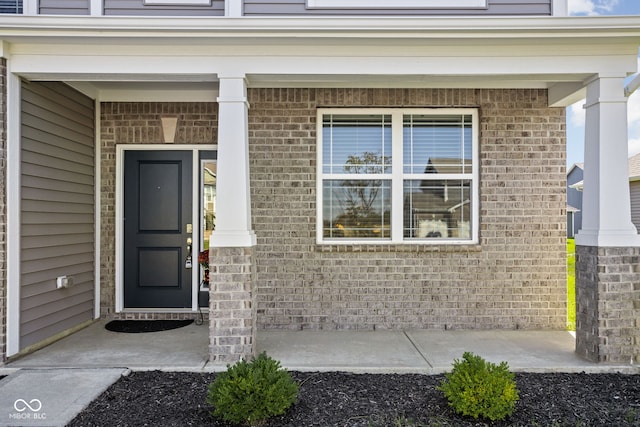 property entrance featuring covered porch