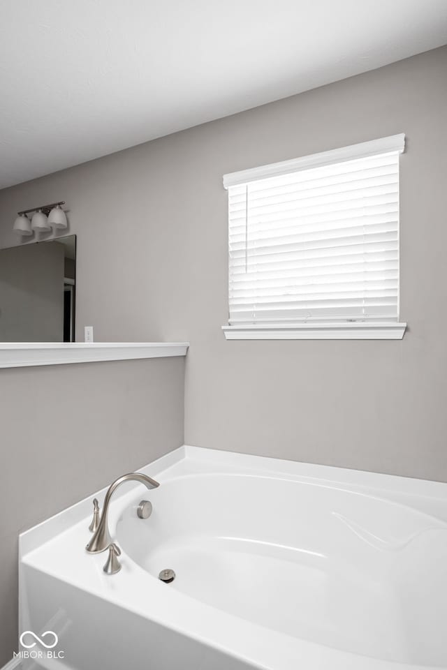 bathroom featuring a tub to relax in