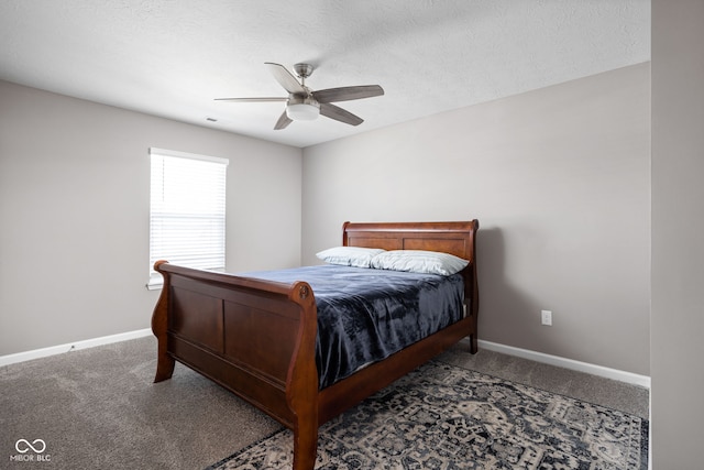 carpeted bedroom with ceiling fan and a textured ceiling