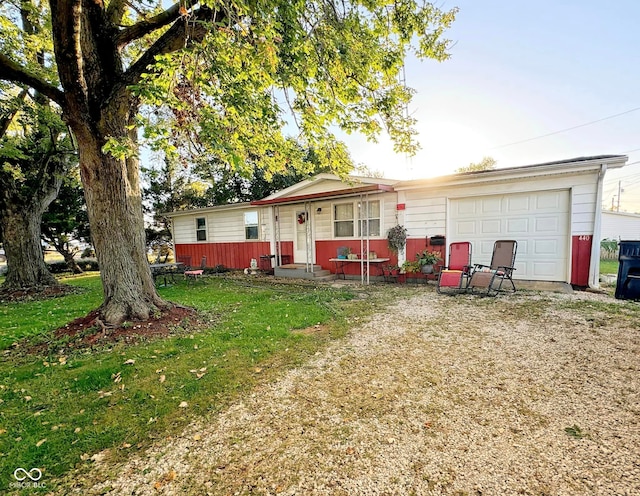 view of front of home with a garage and a front yard