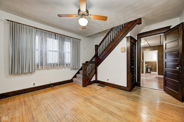 spare room with light hardwood / wood-style flooring and ceiling fan