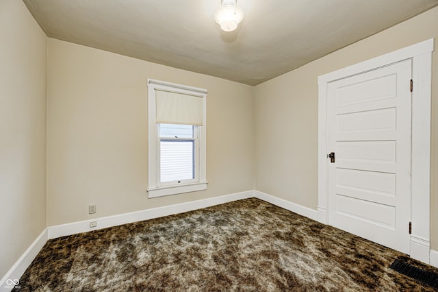 view of carpeted spare room