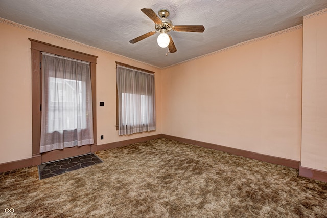 interior space with ceiling fan and a textured ceiling