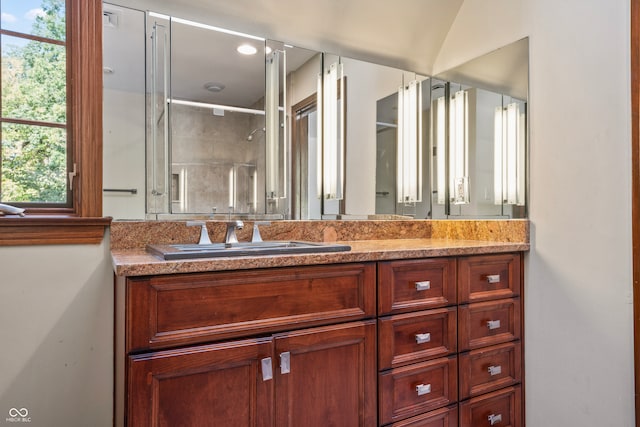 bathroom with vanity and an enclosed shower