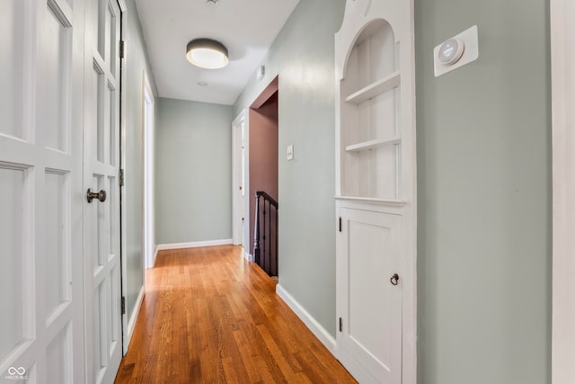 hallway featuring wood-type flooring