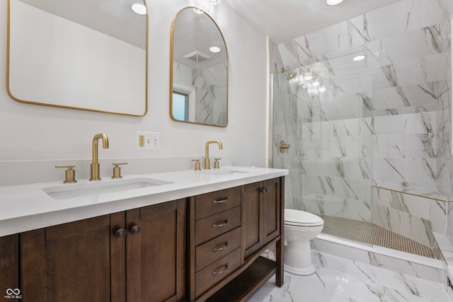 bathroom featuring walk in shower, vanity, and toilet